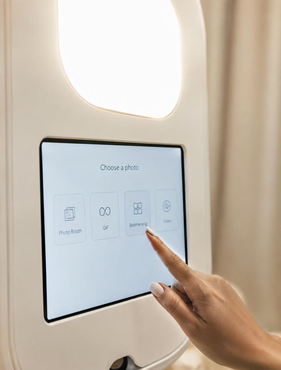 Guest using the booth touchscreen